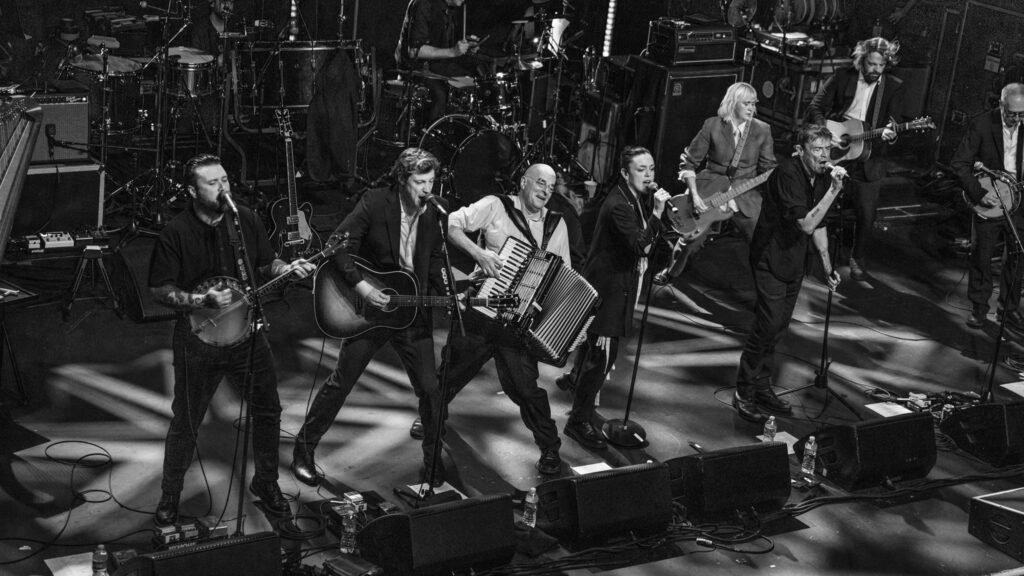 The Pogues performing live on stage